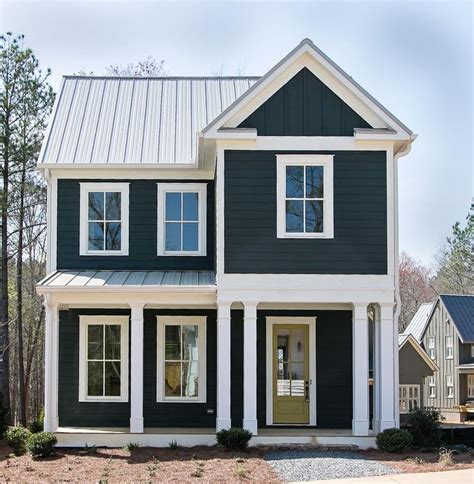 grey metal roof two story house|gray house with metal roof.